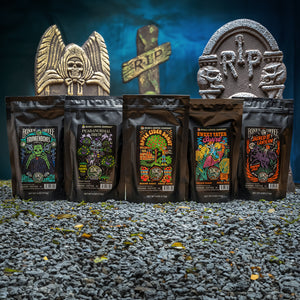 The Fall Favorites Sample Pack on small rocks in front of headstones in a fake graveyard