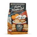 The front of a 12 ounce bag of Bones Coffee Company Frosted Pumpkin Roll coffee. Its flavor is frosted pumpkin roll, and it has skeletal hands cutting into a pumpkin roll on a table with pumpkins in the background on the art.