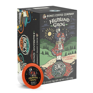 The front of the Bones Coffee Company Highland Grog 12 Count Bones Cups box. Its flavor is butterscotch and caramel, and it has a skeleton wearing a kilt playing bagpipes on a hill on the art.