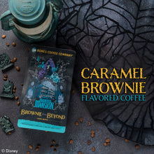 A 12 ounce bag of flavored coffee inspired by Disney Haunted Mansion named Brownie From Beyond. To the right of the coffee is text saying Caramel Brownie Flavored Coffee.
