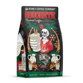 The front of a 12 ounce bag of Bones Coffee Company Horchata coffee. Its flavor is horchata, and it has a skeleton holding out a glass of horchata between palm trees and lights on the art.