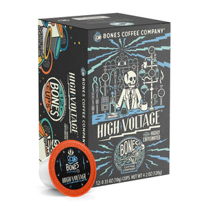 The front of the Bones Coffee Company High Voltage 12 Count Bones Cups box. It has a skeleton dressed up in a lab coat inside a laboratory on the art.