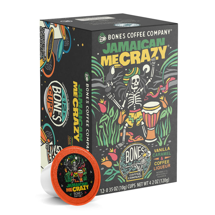 The front of the Bones Coffee Company Jamaican Me Crazy 12 Count Bones Cups box. Its flavor is vanilla, caramel, and coffee liqueur, and it has a skeleton with a hat and dreadlocks dancing around with a bongo nearby on the art.