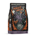 The front of a 12 ounce bag of Bones Coffee Company Jacked O’ Lantern coffee. Its flavor is pumpkin spice, and it has a skeleton with a pumpkin on its head riding a horse on the art. 