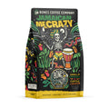 The front of a 12 ounce bag of Bones Coffee Company Jamaican Me Crazy coffee. Its flavor is vanilla, caramel, and coffee liqueur, and it has a skeleton wearing a hat with dreadlocks dancing around with a bongo nearby on the art. 