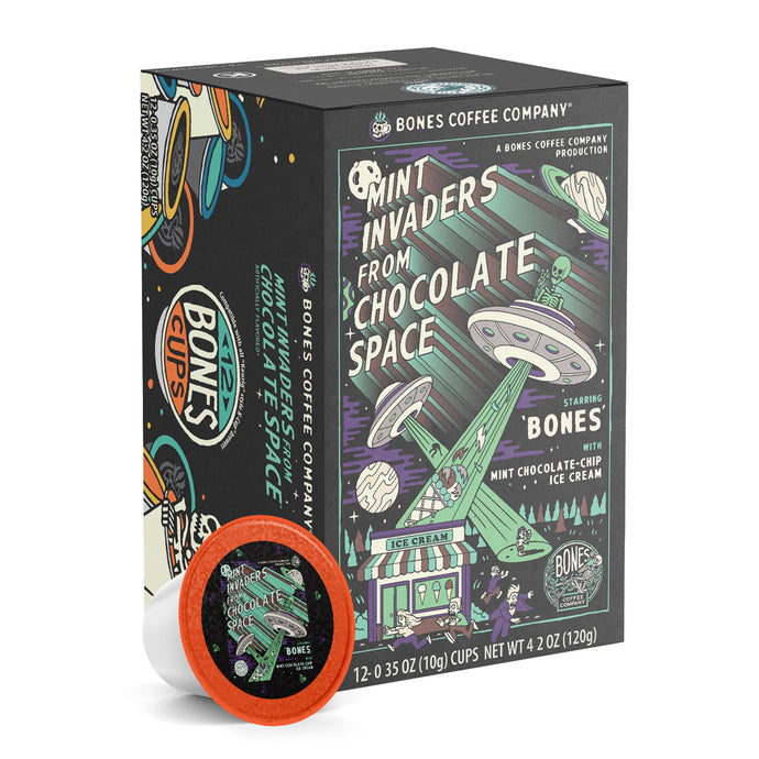 The front of the Bones Coffee Company Mint Invaders from Chocolate Space 12 Count Bones Cups box. Its flavor is mint chocolate chip ice cream, and it has green skeletons abducting ice cream and people into their UFOs on the art.