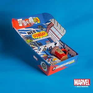 The collector's box inspired by Marvel Spider-Man. It is open and on the upper fold it says Web-Slinger. Inside is a 12 ounce bag of flavored coffee and red mug with a white glaze on top of it with a golden medallion in the center.