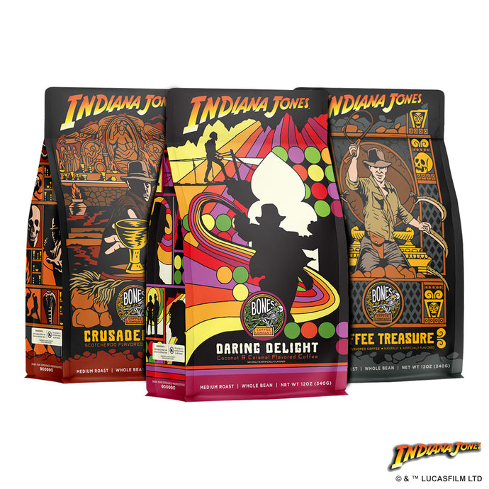 Three 12 ounce bags of flavored coffee inspired by Lucasfilm's Indiana Jones. From left to right they're named Crusader's Cup, Daring Delight, and Toffee Treasure.