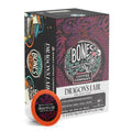 The front of the Bones Coffee Company Dragon’s Lair 12 Count Bones Cups box. Its tasting notes are caramelized sugars, cacao, and smoky. It has the Bones Coffee Company logo in the center of the art with a skeleton drinking coffee on greenery. A red dragon is around the logo.