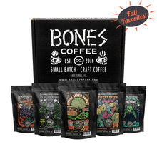Five bags of four ounces of flavored coffee. From left to right their names are Jacked O' Lantern, Pear-anormal Brew, Apple Cider Donut, Sweet Tater Swirl, and Frankenbones. A box is behind it that says Bones Coffee. There is a sun above them that says Fall Favorites.