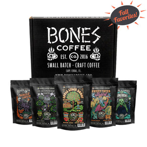 Five bags of four ounces of flavored coffee. From left to right their names are Jacked O' Lantern, Pear-anormal Brew, Apple Cider Donut, Sweet Tater Swirl, and Frankenbones. A box is behind it that says Bones Coffee. There is a sun above them that says Fall Favorites.