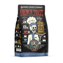 The front of a 12 ounce bag of Bones Coffee Company French Toast coffee. Its flavor is french toast, and it has a skeleton wearing a chef’s coat and hat holding up a plate of fresh french toast on the art.