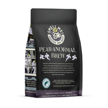 The back of a 12 ounce flavored coffee bag named Pear-anormal Brew. The Rain Forest Alliance page on the lower left of the back of the bag, and it says to squeeze and sniff at the top of the bag. Below the squeeze and sniff text is the name Pear-anormal Brew.