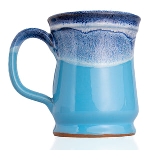 The back of the Shark Bite mug. It is colored ocean blue with a white glaze on top of it.
