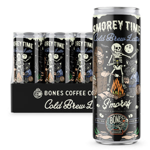 A 12-pack of cold brew lattes. Inside the pack is the S’morey Time cold brew lattes. A single can of this cold brew latte is on the side and has a skeleton holding a flashlight with bigfoot and a werewolf around a campfire making s’mores on the art.