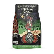The front of a 12 ounce bag of Bones Coffee Company Highland Grog coffee. Its flavor is caramel and butterscotch, and it has a skeleton wearing a kilt playing bagpipes on a hill on the art.