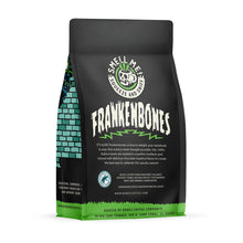 The back of a 12 ounce flavored coffee bag named Frankenbones. The Rain Forest Alliance page on the lower left of the back of the bag, and it says to squeeze and sniff at the top of the bag. Below the squeeze and sniff text is the name Frankenbones.