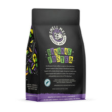 The back of a 12 ounce flavored coffee bag named Bananas Foster. The Rain Forest Alliance page on the lower left of the back of the bag, and it says to squeeze and sniff at the top of the bag. Below the squeeze and sniff text is the name Bananas Foster.