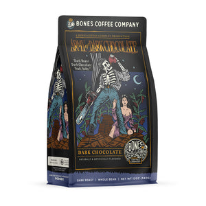 The front of a 12 ounce bag of Bones Coffee Company Army of Dark Chocolate coffee. Its flavor is dark chocolate, and it has a skeleton wielding a chainsaw standing on dark chocolate with a woman clinging to its leg on the art.
