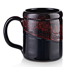 The back of the From Dusk til Dawn mug. It is black colored with a red glaze on top of it.