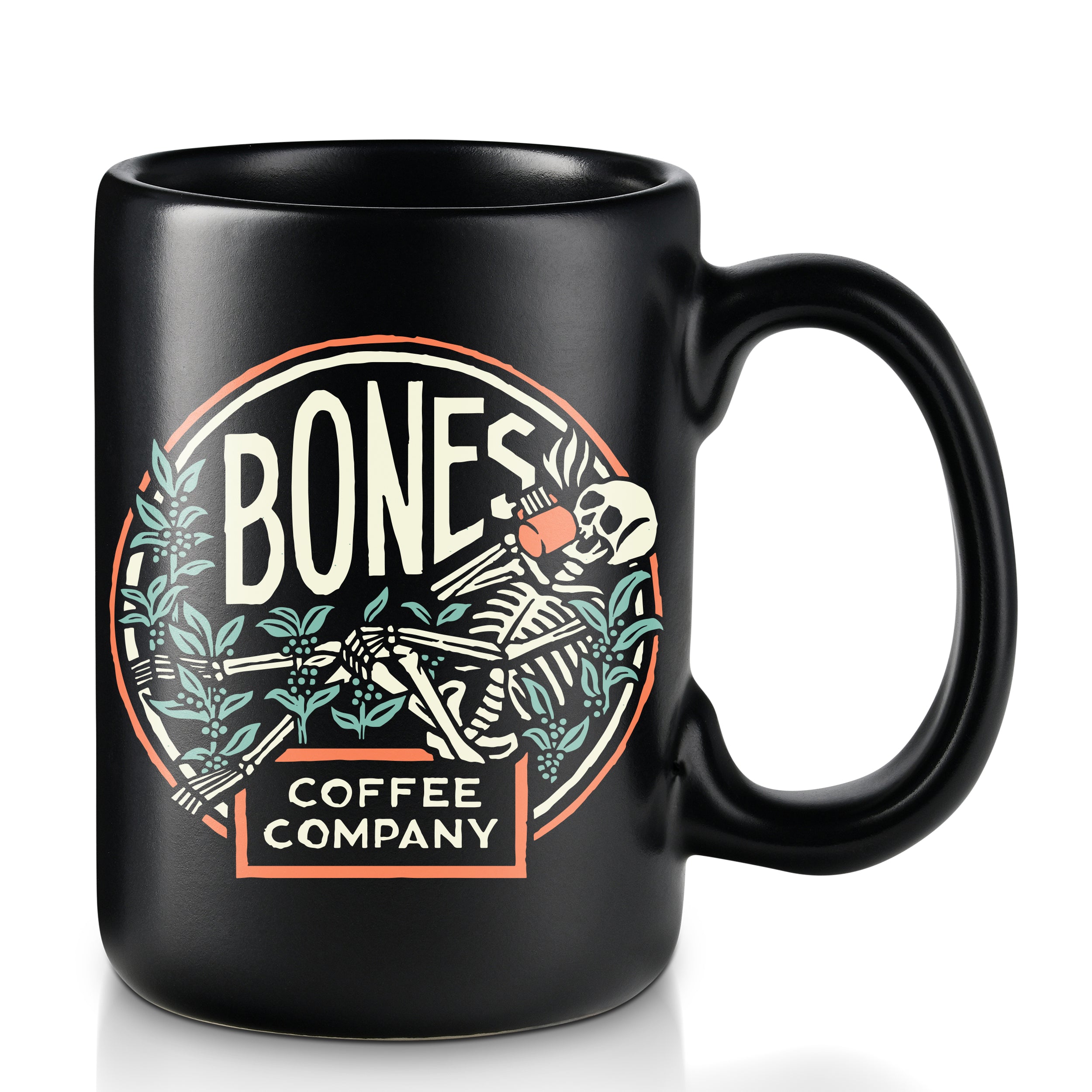 A black colored mug that has the Bones Coffee Company's classic logo on it. The logo has a skeleton resting on greenery sipping on coffee.