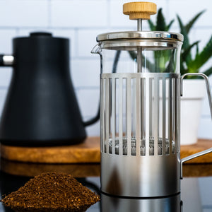 A Hario THT-4 MSV coffee press that has a stainless steel cage inside a kitchen.