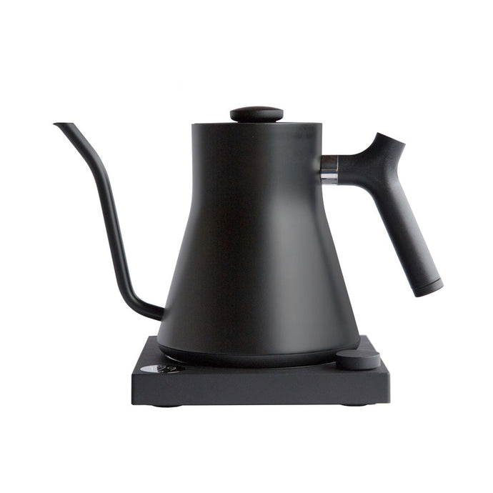 A black Stagg EKG electric goose neck kettle made by Fellow.