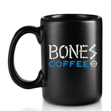 The back of the High Voltage mug. It is colored black and has the logo for Bones Coffee Company on it.