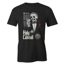The front of the Holy Cannoli men's tee shirt. It is colored black has the art of the Holy Cannoli coffee on it.The art has a skeleton holding a cannoli like a cigar dressed in a suit with a red rose on its lapel.