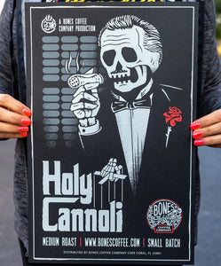 The Holy Cannoli poster being held by someone.