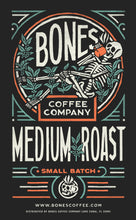 The art for Medium Roast. Its has the Bones Coffee Company logo that has a skeleton sipping coffee, lounging on greenery around it.