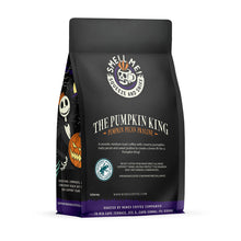 The back of a 12 ounce flavored coffee bag named The Pumpkin King. The Rain Forest Alliance page on the lower left of the back of the bag, and it says to squeeze and sniff at the top of the bag. Below the squeeze and sniff text is the name The Pumpkin King.