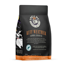 The back of a 12 ounce flavored coffee bag named Ruff Weather. The Rain Forest Alliance page on the lower left of the back of the bag, and it says to squeeze and sniff at the top of the bag. Below the squeeze and sniff text is the name Ruff Weather.