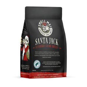 The back of a 12 ounce flavored coffee bag named Santa Jack. The Rain Forest Alliance page on the lower left of the back of the bag, and it says to squeeze and sniff at the top of the bag. Below the squeeze and sniff text is the name Santa Jack.
