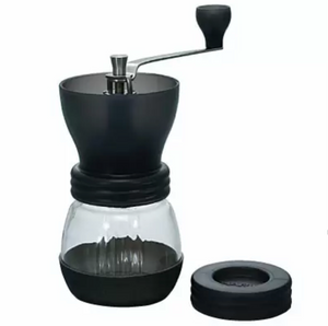 A black colored Hario Skerton plus ceramic coffee mill.