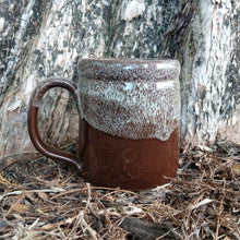 The back of the S’morey Time mug. It is chocolate colored and has a white glaze on top of it.