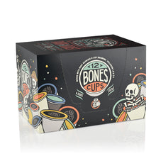 The side of the box for the Dark Roast Cups. It showcases that it holds 12 Bones cups and has skeletons peeking out from behind and inside Bones Cups along the box.