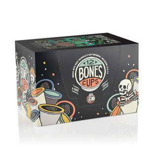 The side of the box for the Irish Cream Bones Cups. It showcases that it holds 12 Bones cups and has skeletons peeking out from behind and inside Bones Cups along the box.