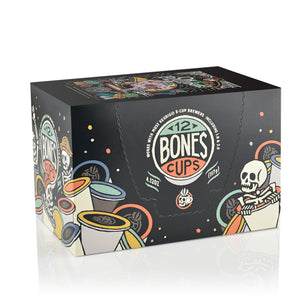 The side of the box for the Oh Fudge Cups. It showcases that it holds 12 Bones cups and has skeletons peeking out from behind and inside Bones Cups along the box.