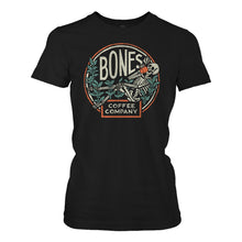 The women's classic Bones Coffee Company logo tee shirt. The tee shirt is black and the logo has a skeleton sipping coffee resting on greenery.