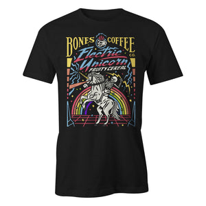 The front of the men's Electric Unicorn tee shirt. It is colored black and has the art of the Electric Unicorn coffee on it. It showcases a skeleton riding a unicorn in front of a rainbow on the art.