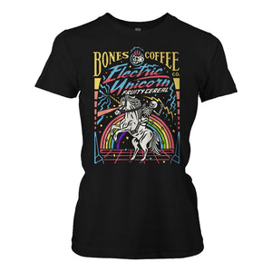 The front of the women's Electric Unicorn tee shirt. It is colored black and has the art of the Electric Unicorn coffee on it. It showcases a skeleton riding a unicorn in front of a rainbow on the art.