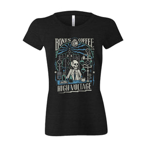The front of the women's High Voltage tee shirt. It is colored black and has the art of the High Voltage coffee on it. It showcases a skeleton in a lab coat inside a laboratory with blue lightning in the background on the art.