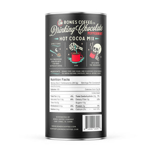 The back of a drinking chocolate mix that has peppermint in it. There are instructions on how to make it on the back alongside a nutrition facts table.