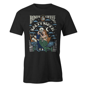 The front of the men's Salty Siren tee shirt. It is colored black and has the art of the Army of Dark Chocolate coffee on it. There is a skeleton wearing a sailor's outfit carrying a mermaid while its ship sinks in the background on its art.