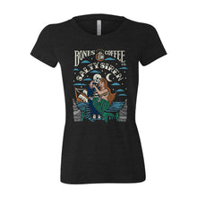 The front of the women's Salty Siren tee shirt. It is colored black and has the art of the Army of Dark Chocolate coffee on it. There is a skeleton wearing a sailor's outfit carrying a mermaid while its ship sinks in the background on its art.