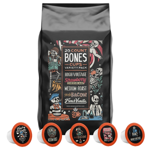 A bag with fives Bones Cups in front of it. It says there's 20 Bones Cups inside and that they're High Voltage, Strawberry Cheesecake, Medium Roast, Maple Bacon, and French Vanilla.