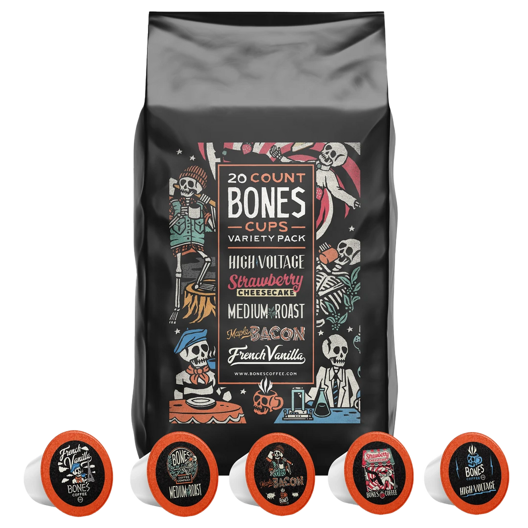 A bag with fives Bones Cups in front of it. It says there's 20 Bones Cups inside and that they're High Voltage, Strawberry Cheesecake, Medium Roast, Maple Bacon, and French Vanilla.