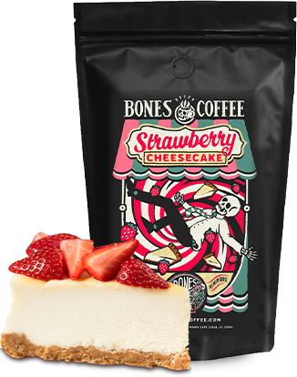 Bones Coffee strawberry cheesecake flavored coffee with a slice of strawberry cheesecake